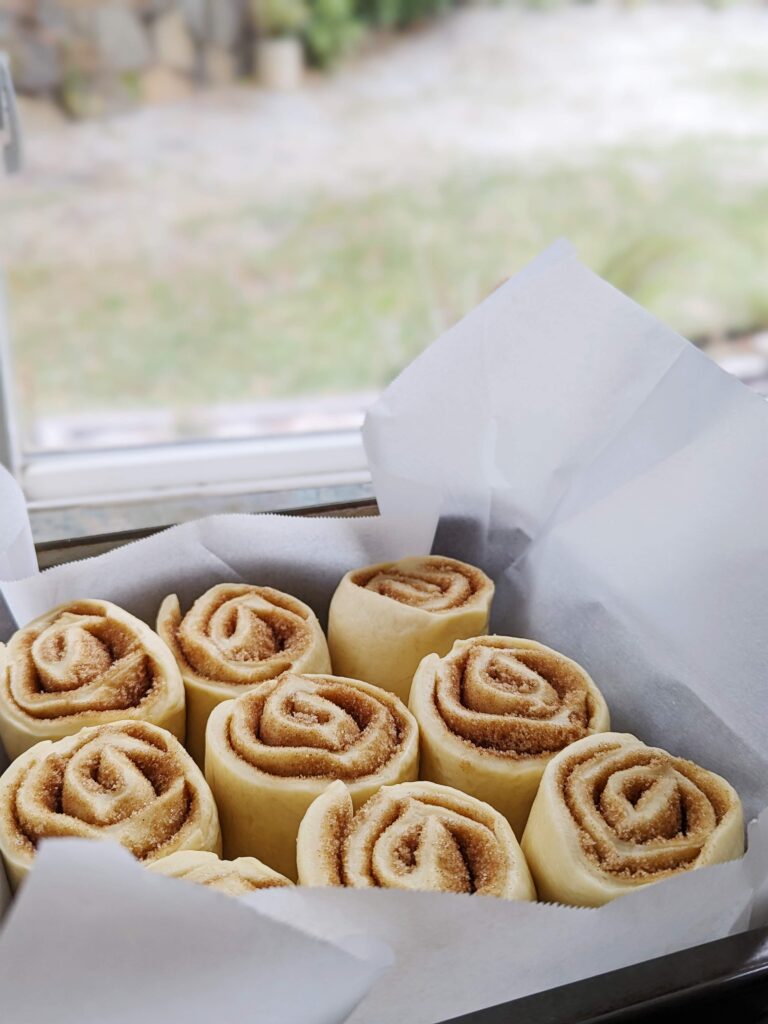fluffy eggnog drizzled cinnamon rolls