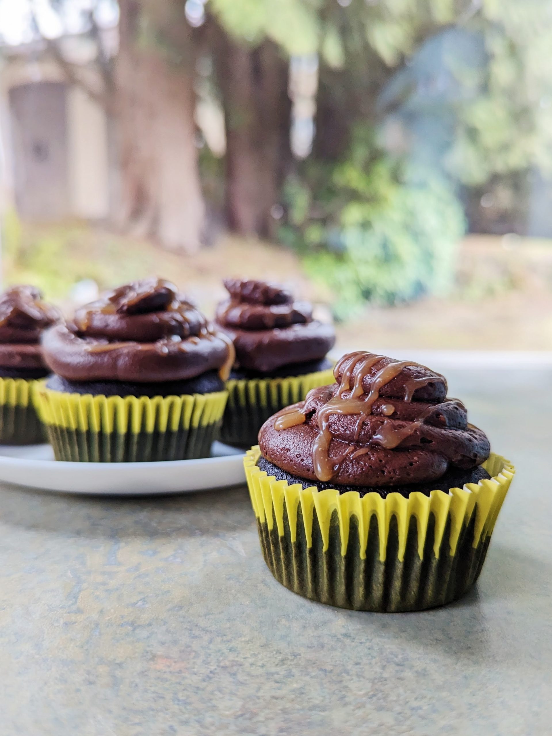 chocolate cupcakes with caramel filling and chocolate frosting